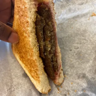 Scrapple with grape jelly sandwich