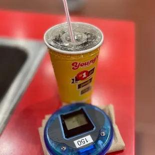 a cup of soda and a digital scale