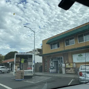 a delivery truck parked in front of a store
