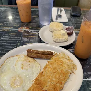 Egg breakfast with sausage links and biscuit