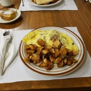 Delicious build-your-own omelette with American cheese, bacon and mushrooms and seasoned home fries!