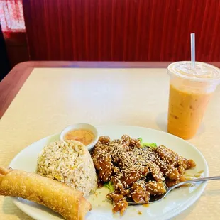 Sesame Chicken, fried rice, Egg Roll, and Thai Ice Tea