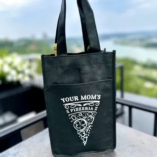 a black tote bag on a table