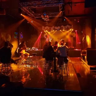 a group of people sitting at a bar