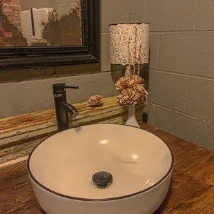 a sink in a rustic bathroom