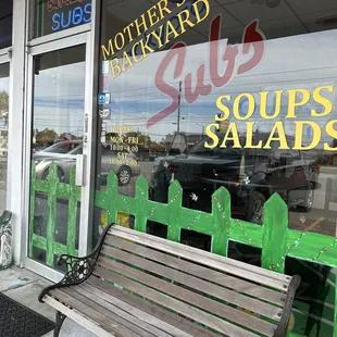 a bench in front of a store