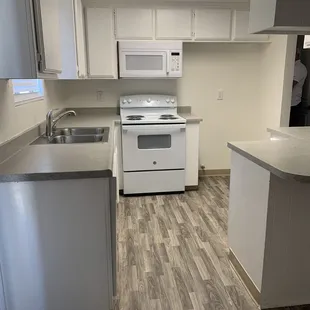 New microwave, stove, dishwasher, faucet, blinds, overhead lighting.