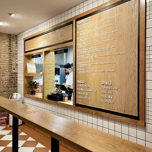 a menu on a wall in a restaurant