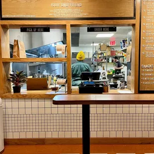 a restaurant counter with a checkered floor