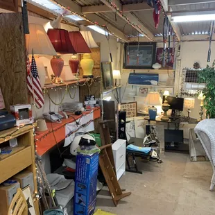 Furniture and electronic room. You find antique lamps and glass antic rare to find glass bulb covers.