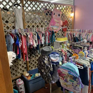 Kids clothing, backpack, teddy bears and toys.