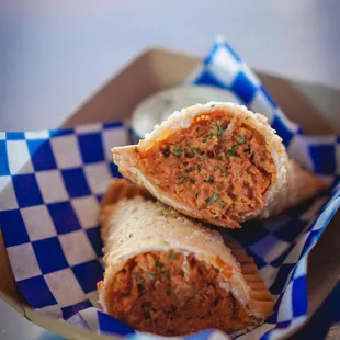 The Latina - Puerto Rican style sofrito based organic chicken empanada. Not spicy just sassy!