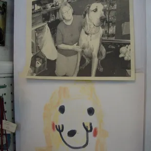 A photo of the owner and her giant Great Dane, in the store, in younger days -- nice!