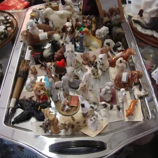 A huge pack of DOG figurines on the front cabinet!