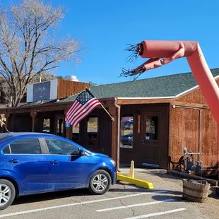 a blue car in a parking lot