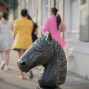 a horse head on a post