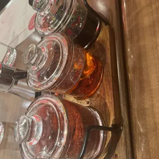 a row of jars of tea on a table