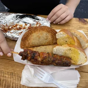 My beautiful Gigi's fingers glazed in bbq sauce, a chicken pincho, beef empanadas and garlic