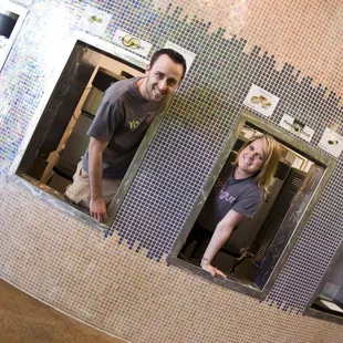 a man and a woman in a kitchen
