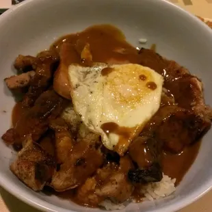 The hungry man special, 2 eggs, 2 spam, fried pork chop, rice and gravy all over... we only got 1 egg tho :(