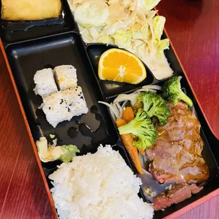a bento box of food