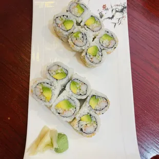 two pieces of sushi on a plate