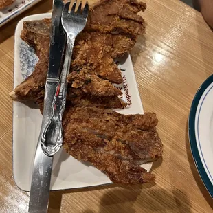 Extra pork chop.  Thin and very overcooked/bone dry.