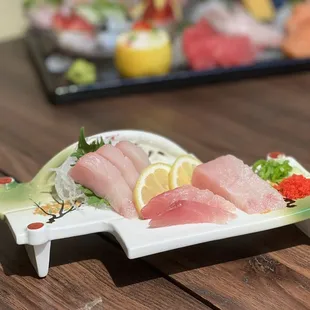 a sushi platter on a wooden table