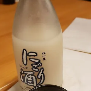 a bottle of milk and a bowl of ramen