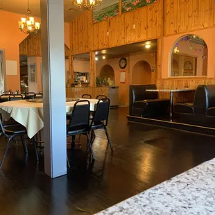 a dining room with tables and chairs