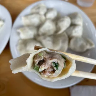 Pork, Shrimp, Egg, &amp; Chive Dumpling ($11.99 for 14) cross section