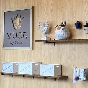 a wooden wall with shelves and a sign