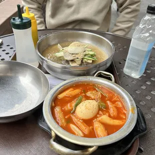 tteokbokki (spicy rice cakes) and naengmyeon (buckwheat noodles).