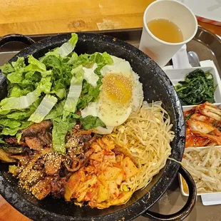 Kimchi Pork Stone Bibimbap ($21.99). The stone pot was sizzling hot! 6/28/2024