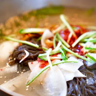 biteofyourworld: Cold noodles in chilled broth (mul naengmyeon) are a must order at Yuchun  Season to taste with vinegar and horseradish