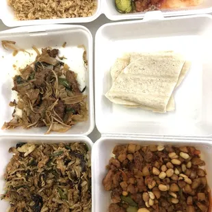 Complementary fried rice, sesame chicken. Half eaten flat rice noodle, mooshu pork and Kung pao chicken.