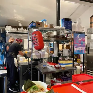 a bowl of ramen and a bowl of broccoli