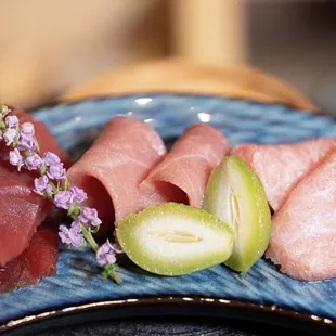 a plate of sushi and vegetables