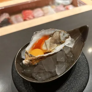 an oyster with an egg in it