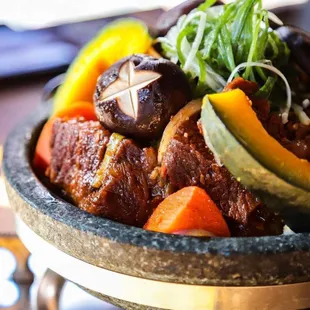 a bowl of stew with vegetables