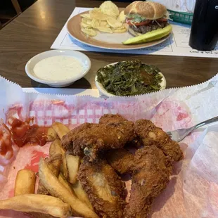 Chicken wings were ok.  A bit over cooked. The greens seemed to be over a day old.  The burger was amazing!   Fries were awesome as well.