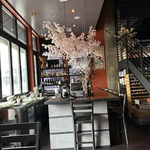 a cherry tree in the middle of the bar