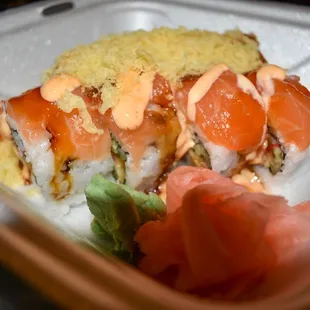 salmon, avocado, and rice in a styrofoam container