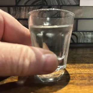 $9 thimble of Kubota Junmai Daiginjo sake as served at Yuki. Way overpriced.