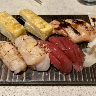 Top left clockwise: Tamago, Salmon Belly Aburi, Bluefin Tuna, Hotate (Hokkaido Scallop) Aburi