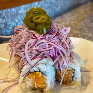 Albacore special

inside: spicy albacore, cucumber
outside: sliced onion, picked jalapeno