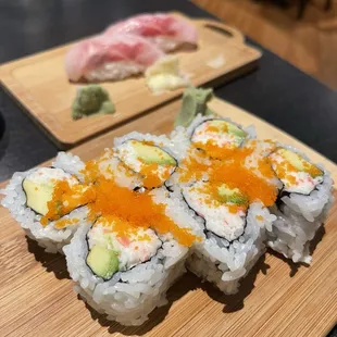 a sushi roll with salmon and avocado