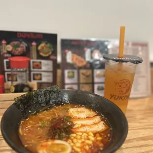 a bowl of ramen and a drink