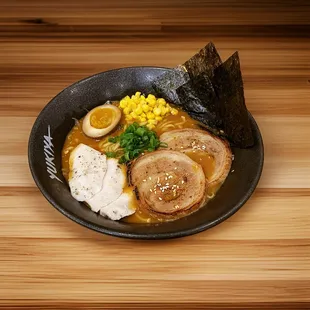 a bowl of ramen and vegetables