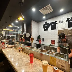 The open kitchen with bar seating